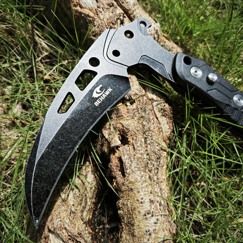 BEHAWK folding sickle glass breaker tip ready for emergencies.