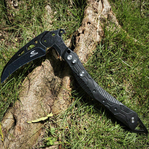 BEHAWK folding sickle quick release allows rapid deployment on trails.