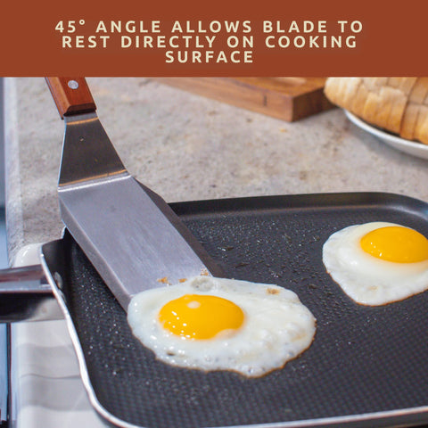 Bellemain spatula on a flat-top grill ready for even flips.