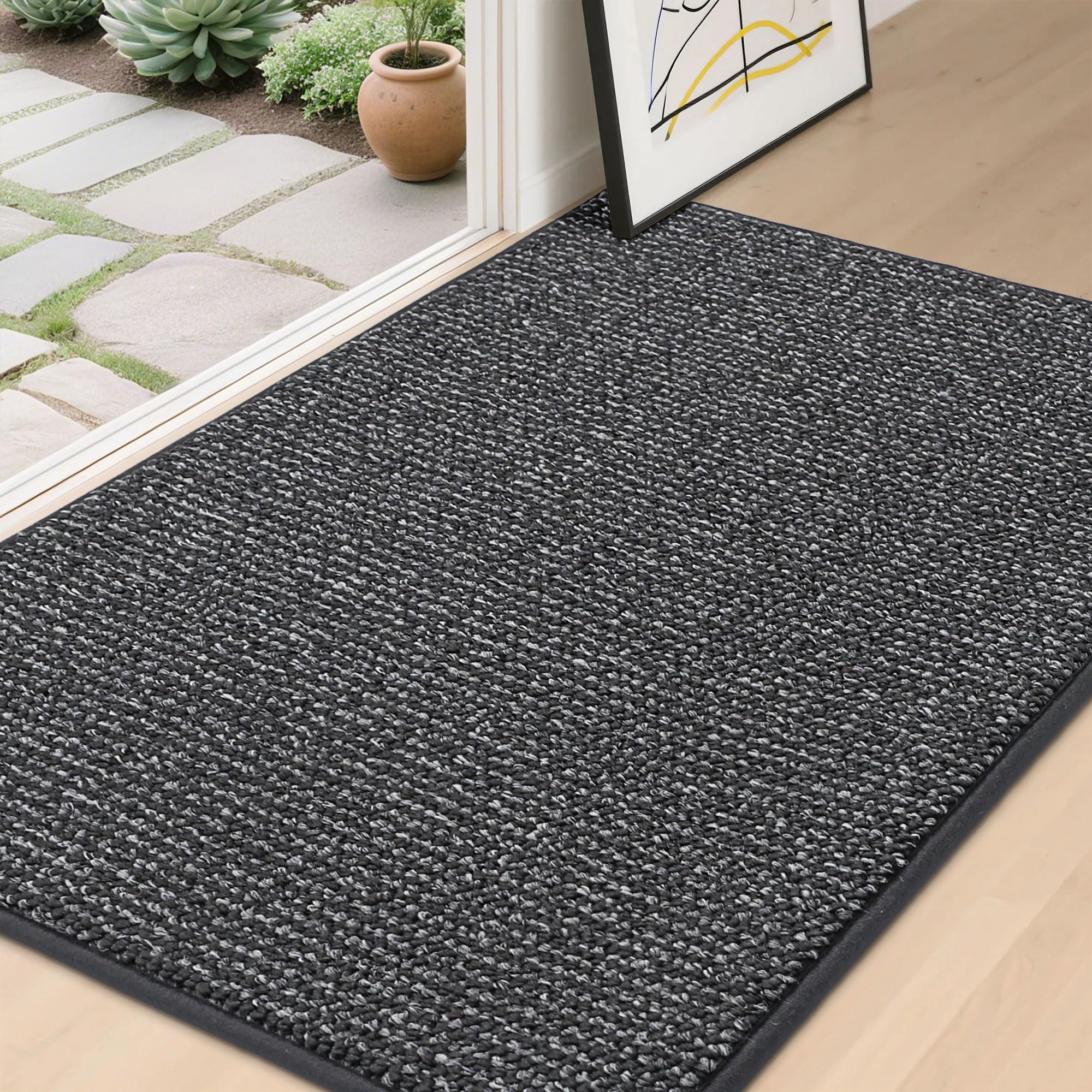 BEQHAUSE Dirt Trapper Door Mat at front door traps dirt and moisture.