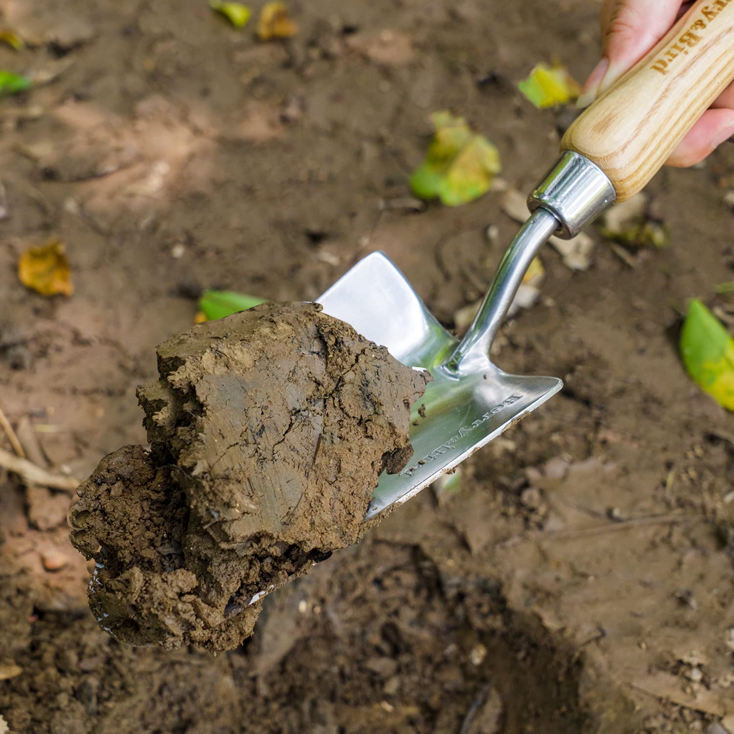 Berry&Bird trowel in soil demonstrates digging and transplanting in small beds