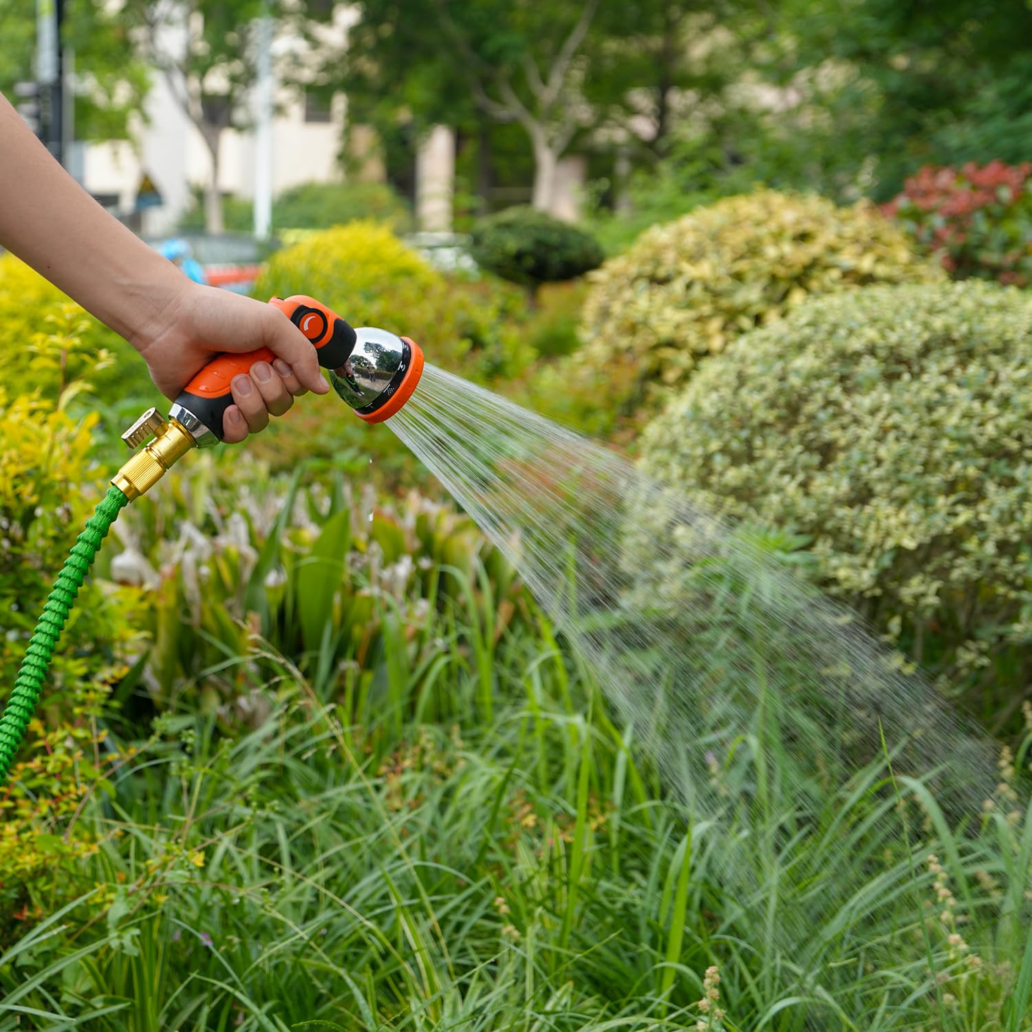 Besiter hose nozzle in action for watering plants and outdoor pets.