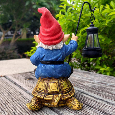 Bezseili hand-painted gnome with red hat adds charm to patio.