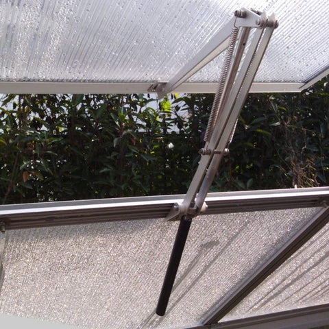 BIBISTORE solar heat-sensitive window opener installed in a greenhouse for automatic ventilation.
