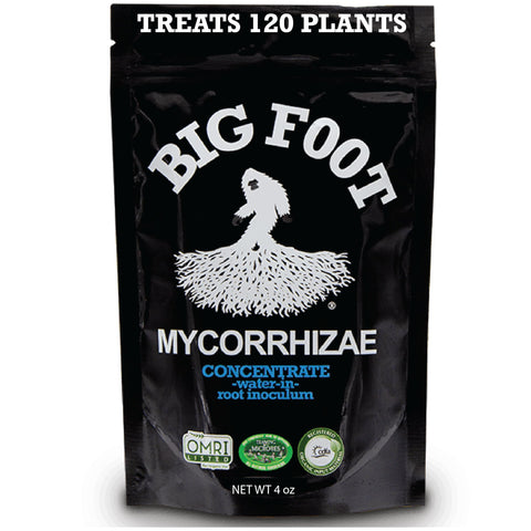 Big Foot mycorrhizae concentrate bottle being poured to support root growth.