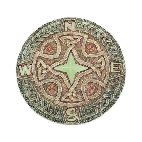 Bits and Pieces glow-in-the-dark Celtic compass stone lights nighttime paths in the garden.