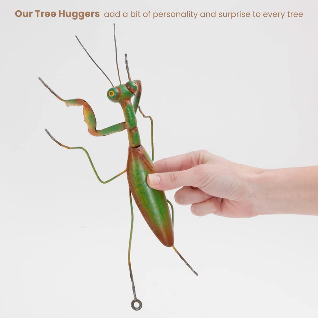 Bits and Pieces Praying Mantis Tree Hanger in garden setup provides whimsical focal point.