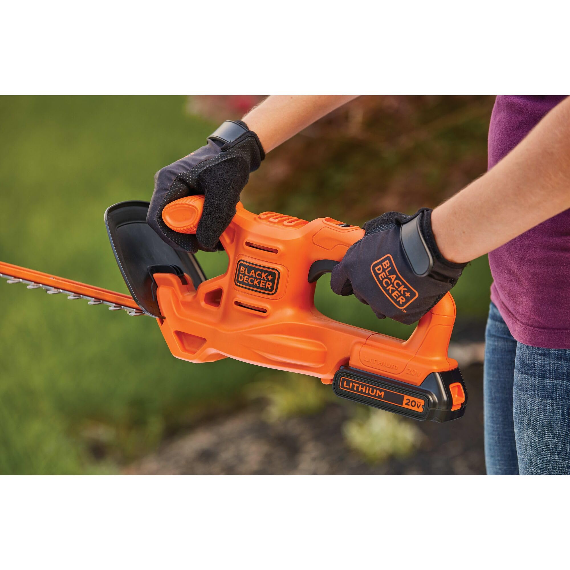 BLACK+DECKER hedge trimmer in use on hedges for steady, clean cuts