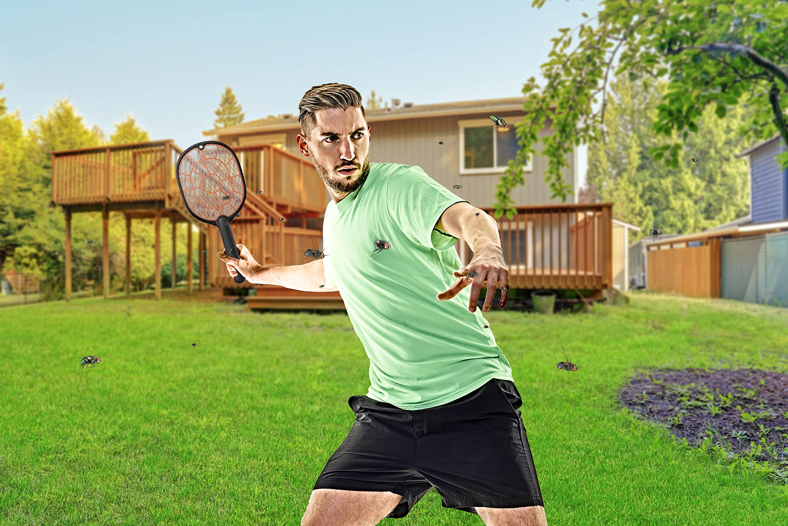BLACK+DECKER Bug Zapper Racket being swung at flying insects.