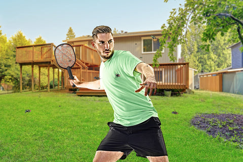 BLACK+DECKER Bug Zapper Racket being swung at flying insects.