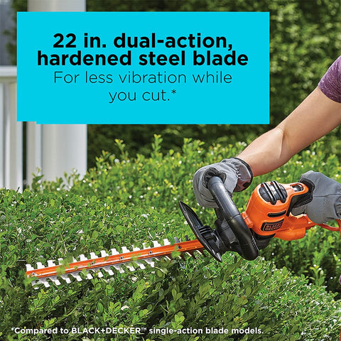 BLACK+DECKER 4-amp motor powering through thick branches for fast shaping.