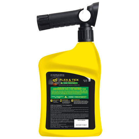 Black Flag flea and tick killer being sprayed on lawn for full coverage.