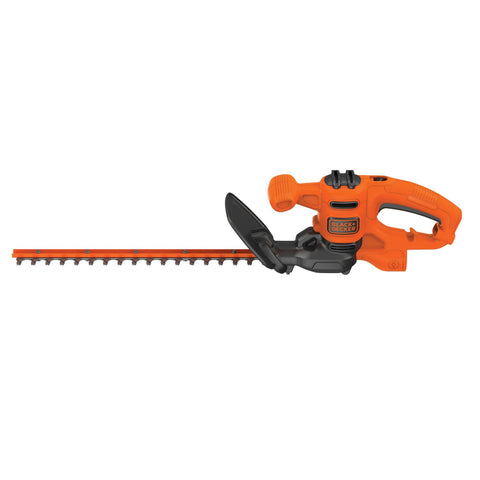 BLACK+DECKER BEHT150 hedge trimmer blade in action delivering clean, even cuts on small hedges.