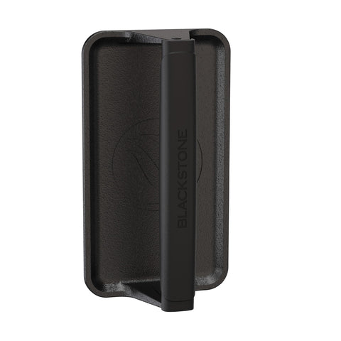Blackstone 5553 pre-seasoned cast iron griddle press on a hot grill for even searing