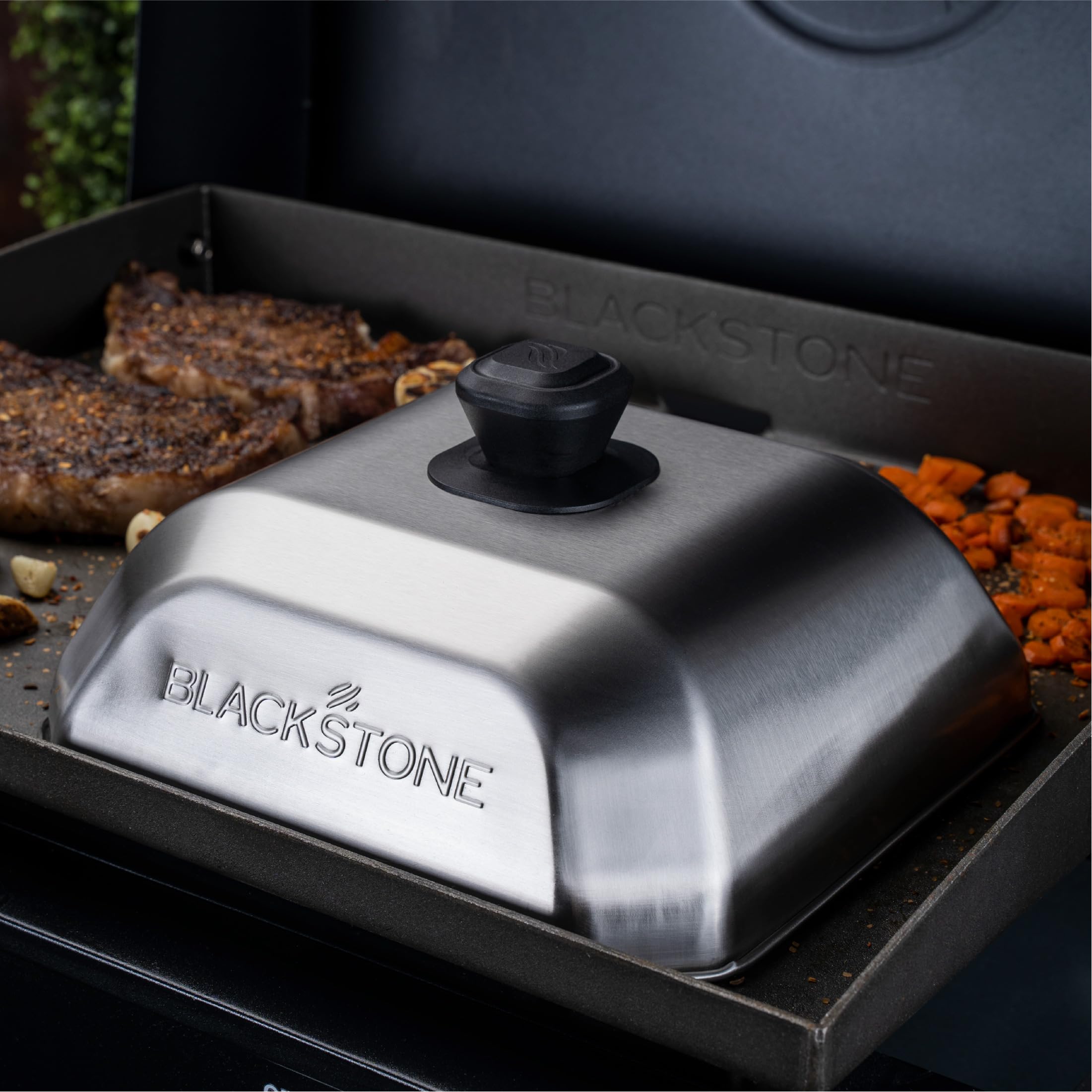 Blackstone 5555 basting cover on griddle demonstrates versatile lid use