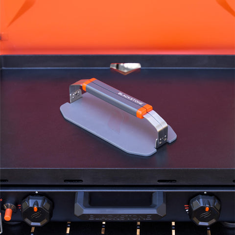 Blackstone 5987 OTG collapsible griddle press with folding handles for compact transport.