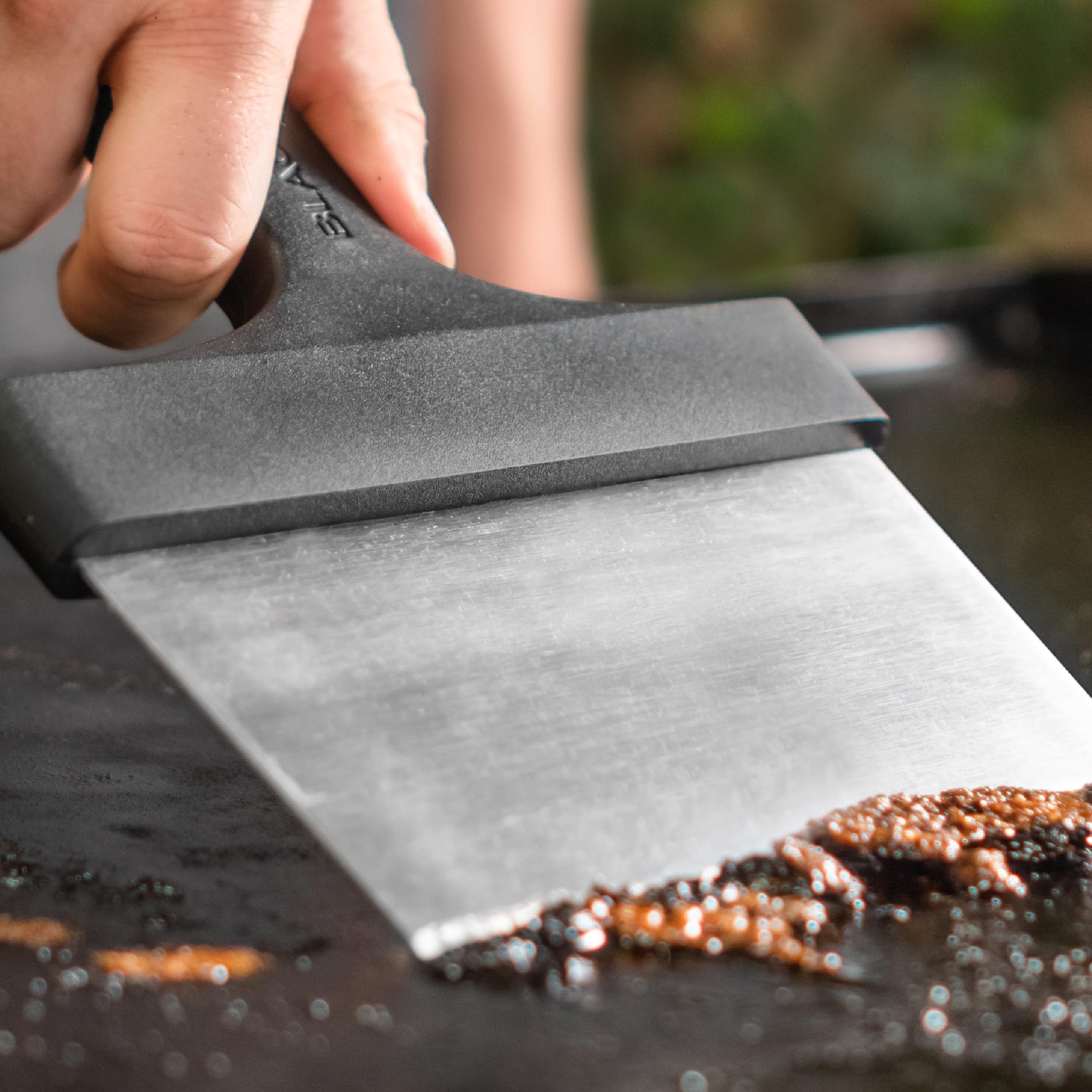 Blackstone griddle scraper featuring a hanging hole for storage