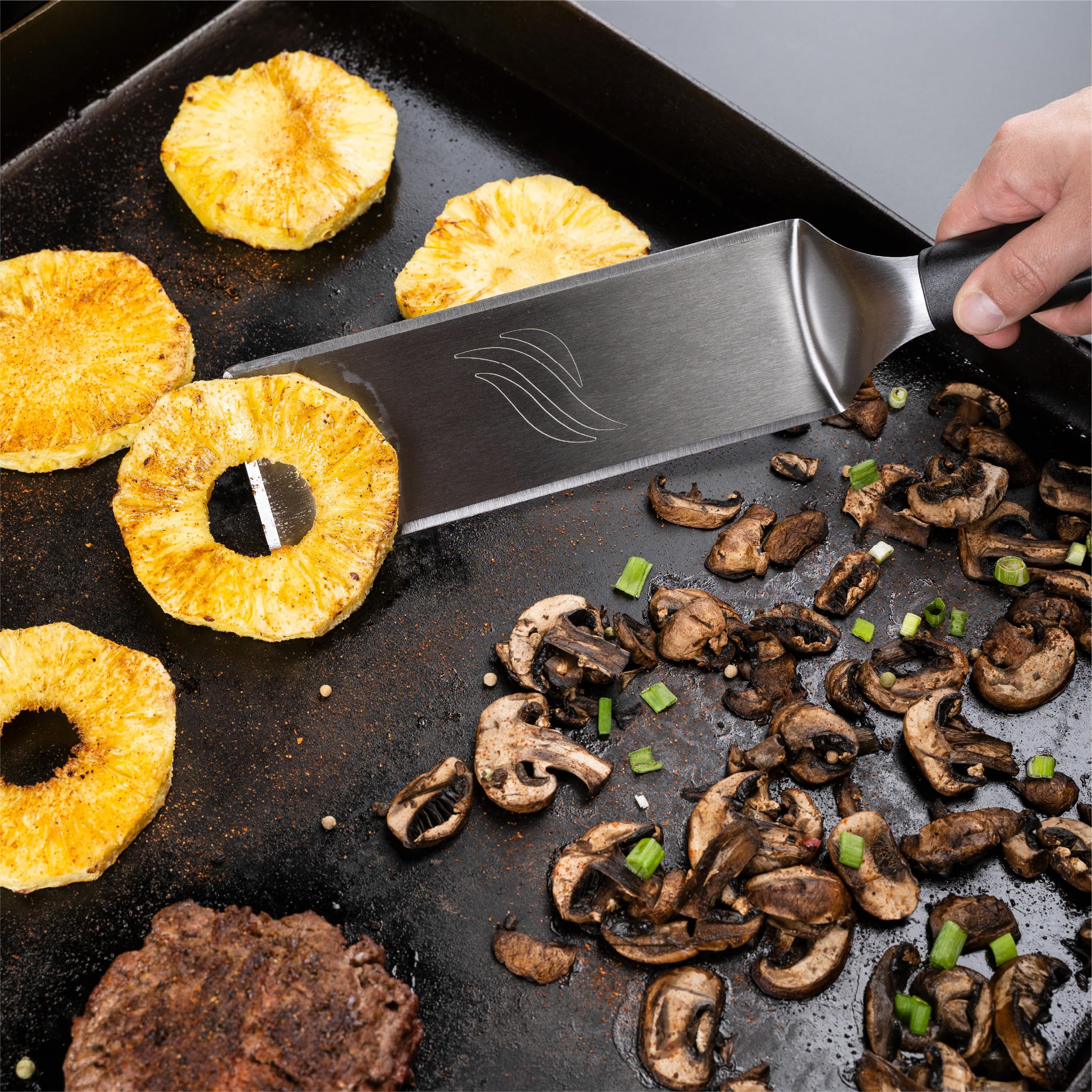 Blackstone scraper tongs provide secure turning and safe handling