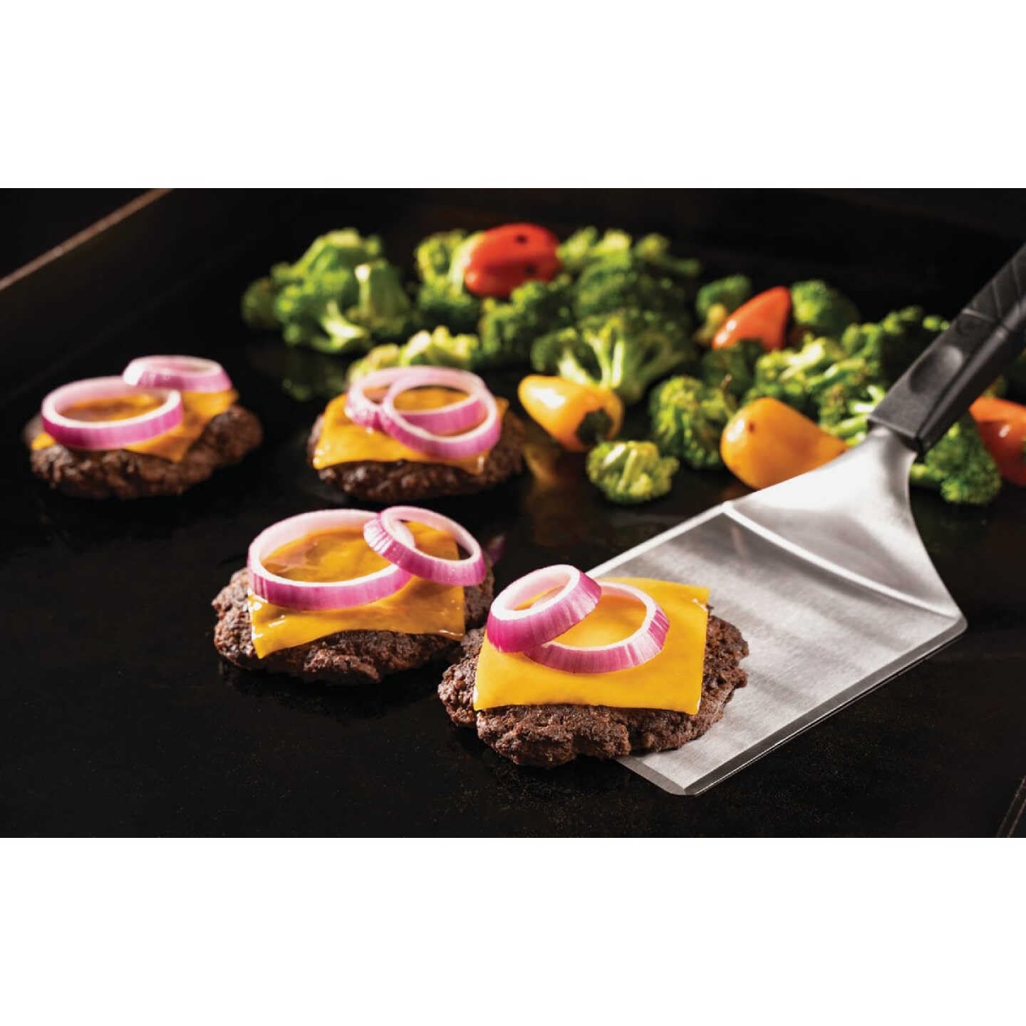 Blackstone Cheese Melt Dome speeds melting while keeping burgers juicy.
