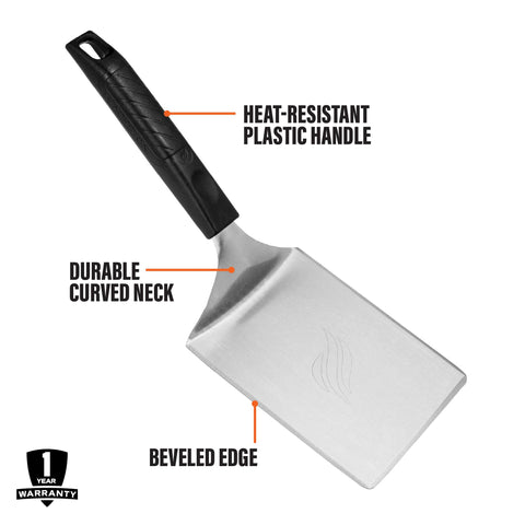 Blackstone spatula smashing a burger patty for even sear on the flat top.