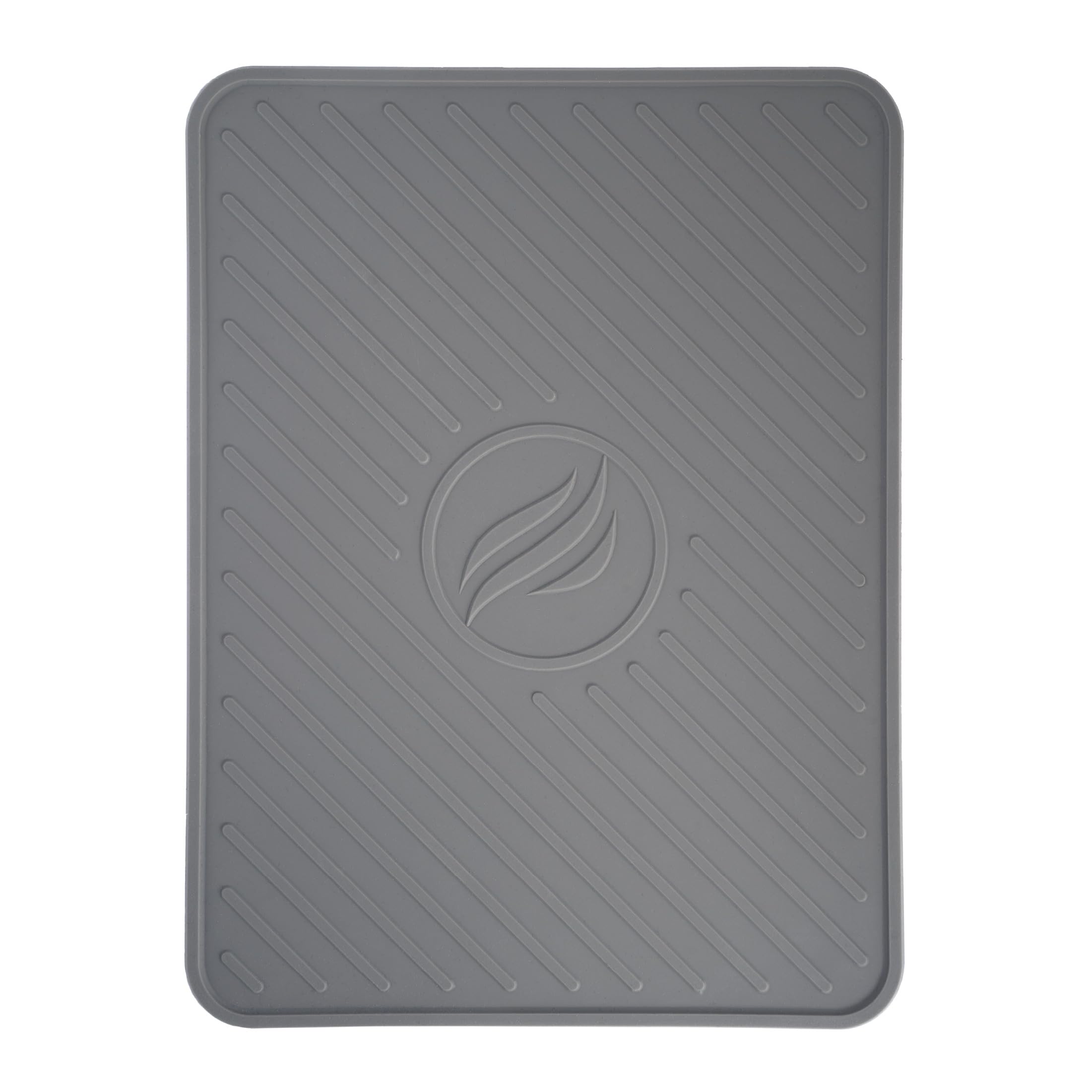BLACKSTONE spatula mat on grill shelf catching drips and protecting surfaces.