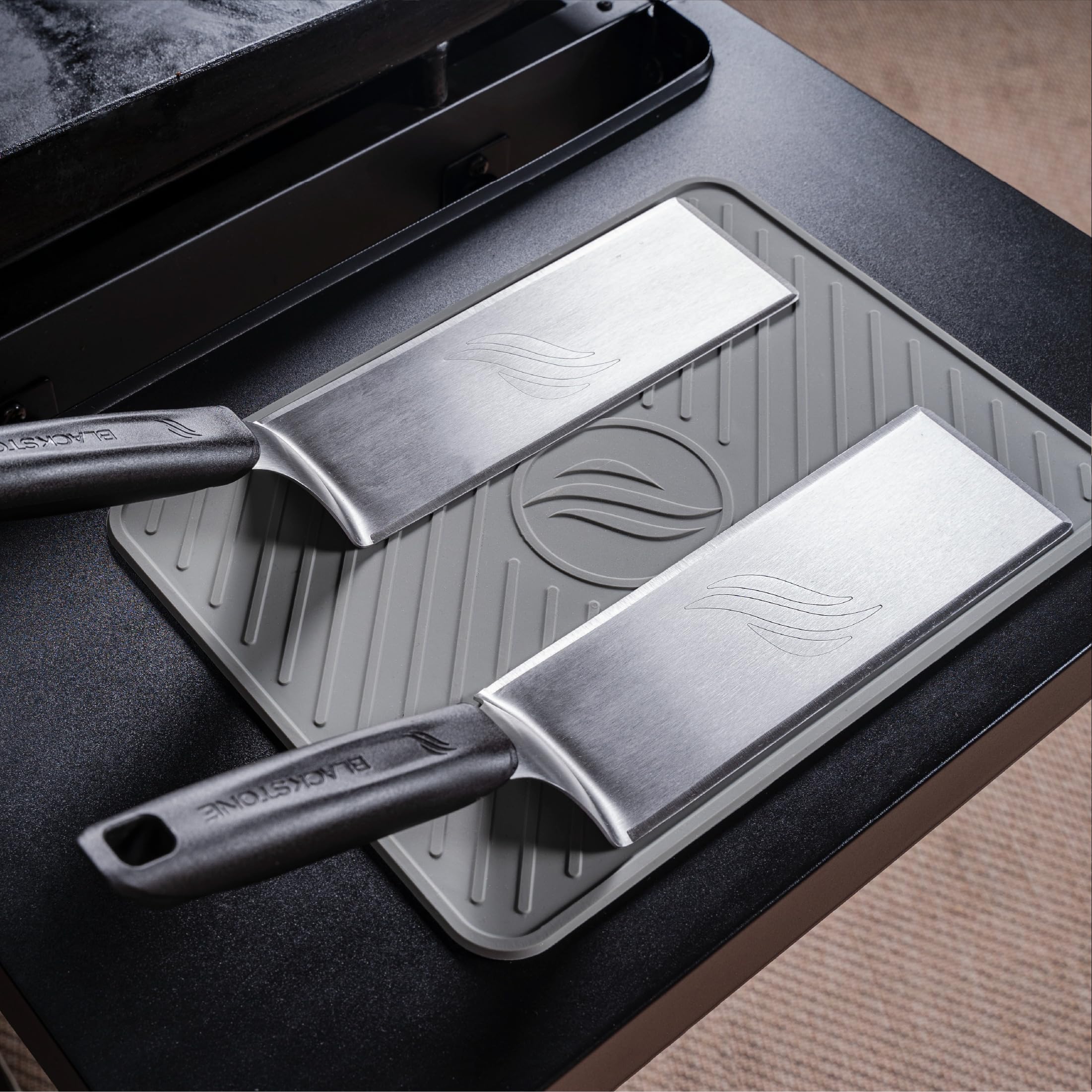 BLACKSTONE spatula mat used as utensil rest to keep counters clean.