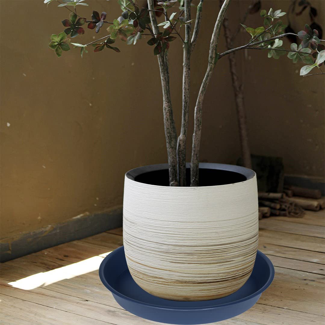 Bleuhome blue bird bath doubles as a plant saucer in the garden.