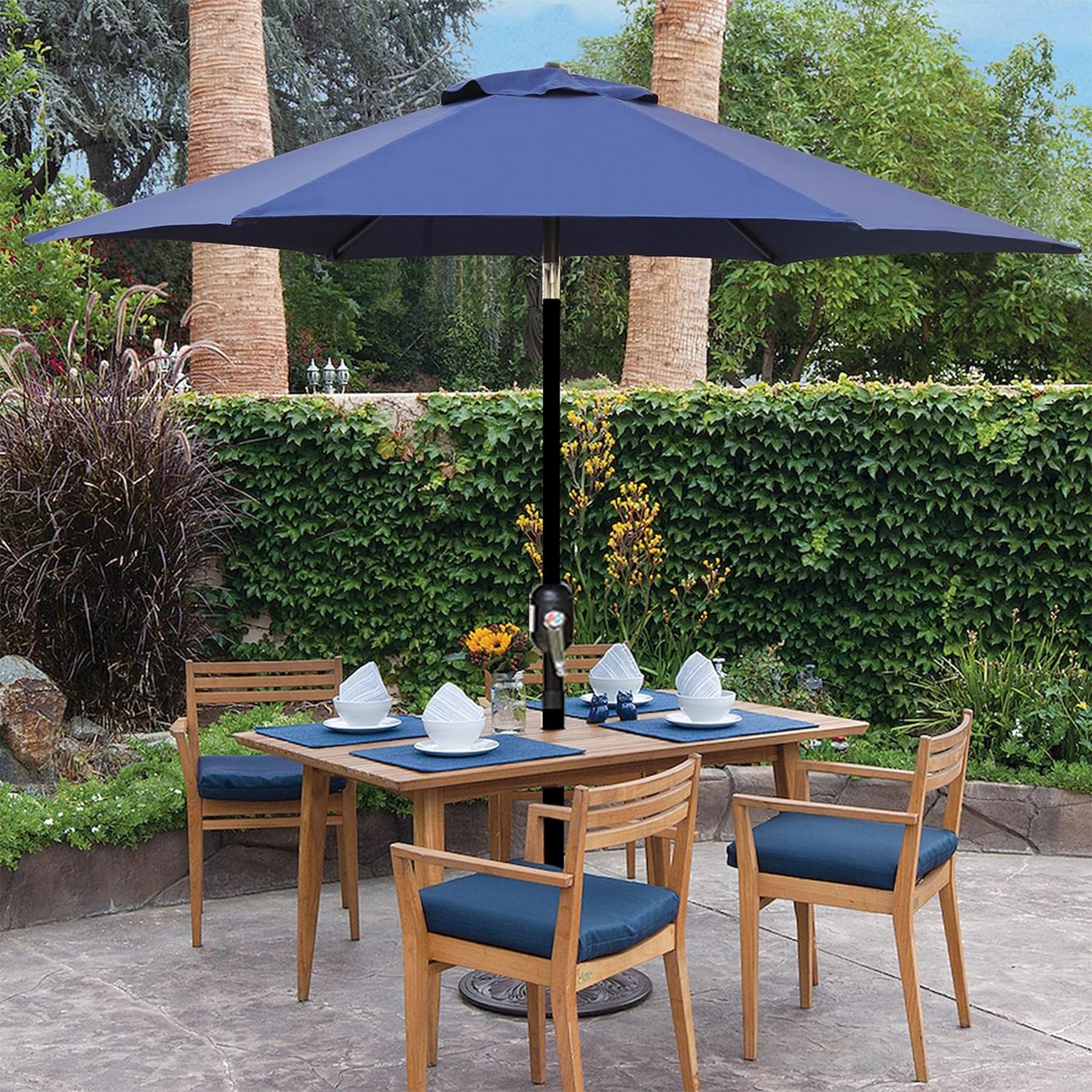 Blissun canopy in use over a table with 2–4 chairs outdoors