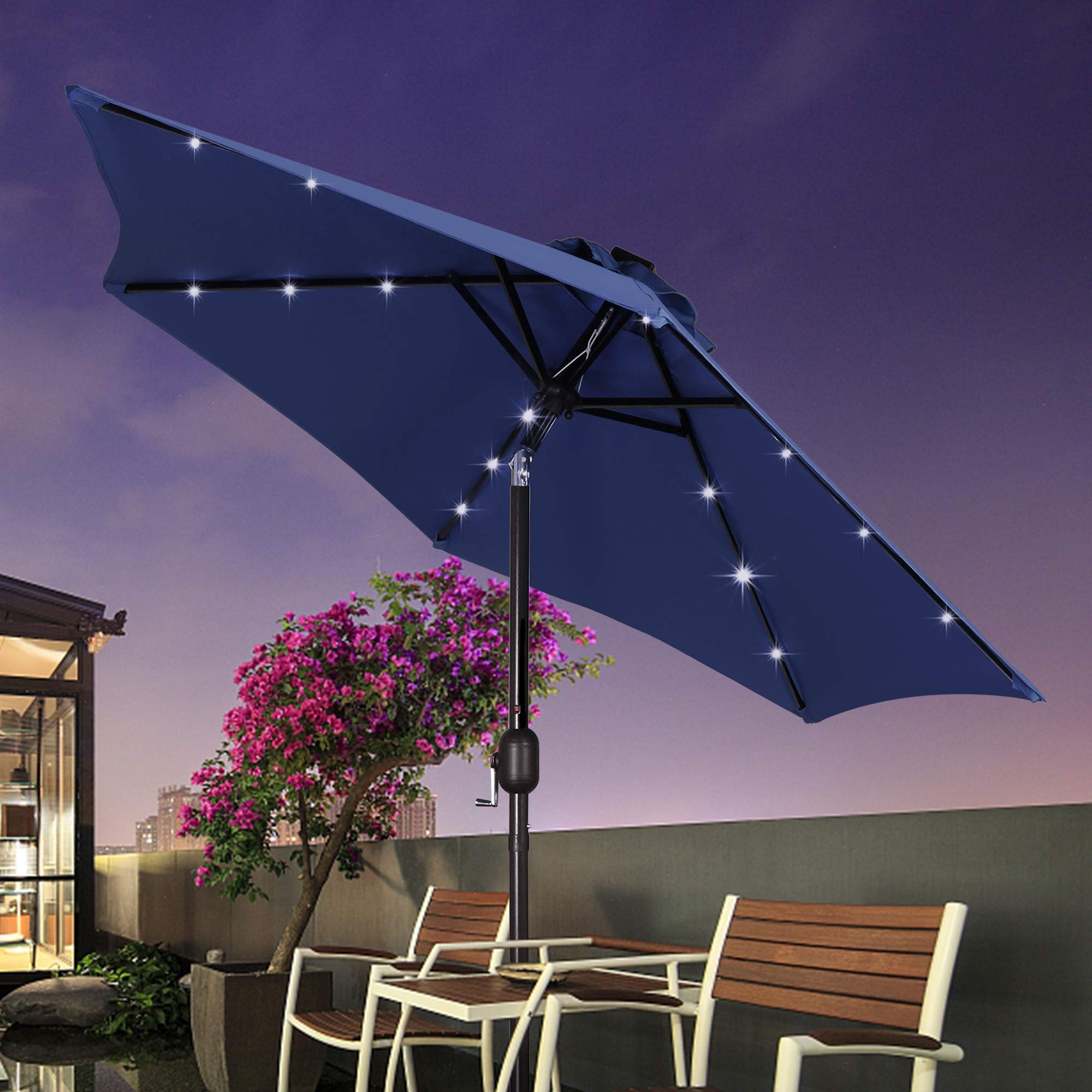 Blissun umbrella in garden setting provides shade and mood lighting