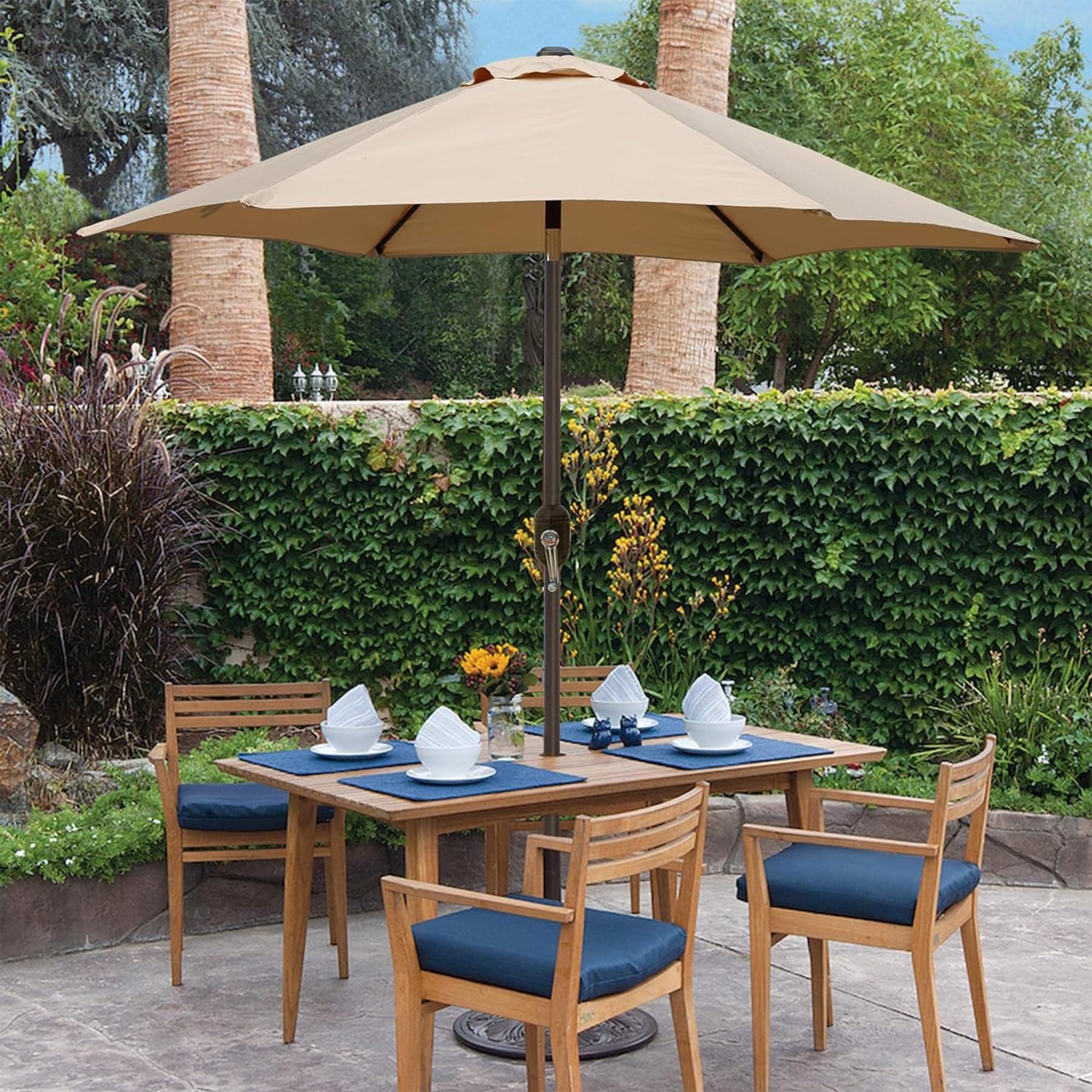 Blissun outdoor dining setup shading a table and chairs