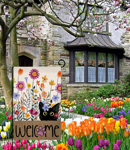 BLKWHT outdoor flag on deck illustrates versatile outdoor use beside flowers
