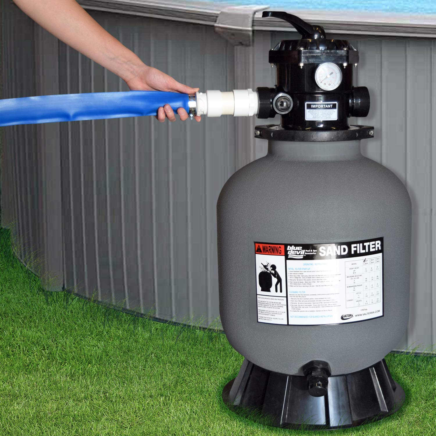 Blue Devil backwash hose storage view suggests easy coil and tidy pool setup.