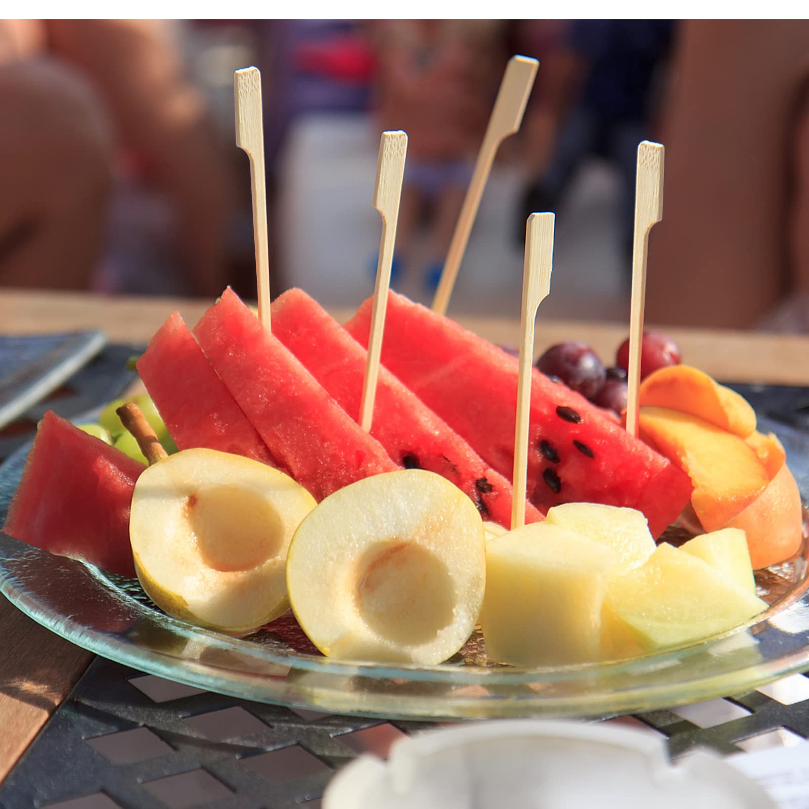 Blue Top bamboo paddle picks shown on the grill for BBQ bites