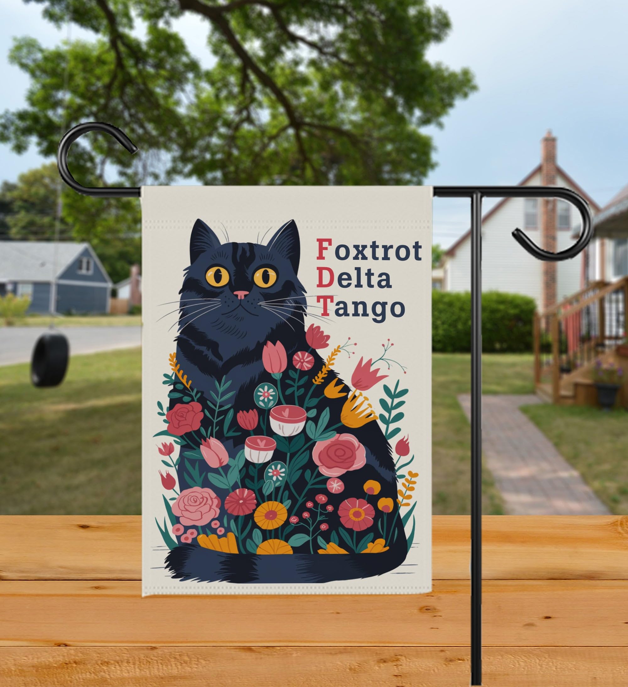 Bob22store Foxtrot Delta Tango garden flag on a porch for year-round decoration.