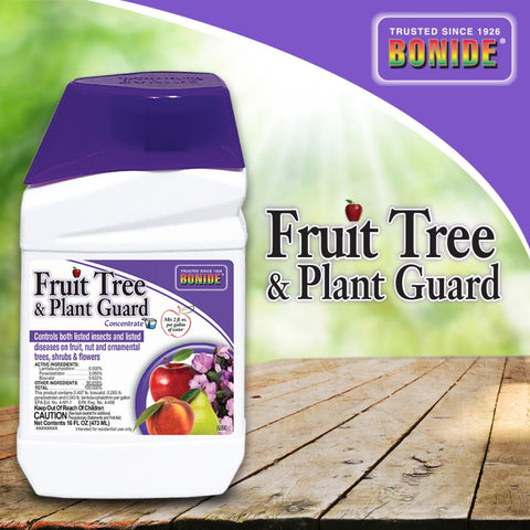 Gardener applying Bonide at a tree canopy