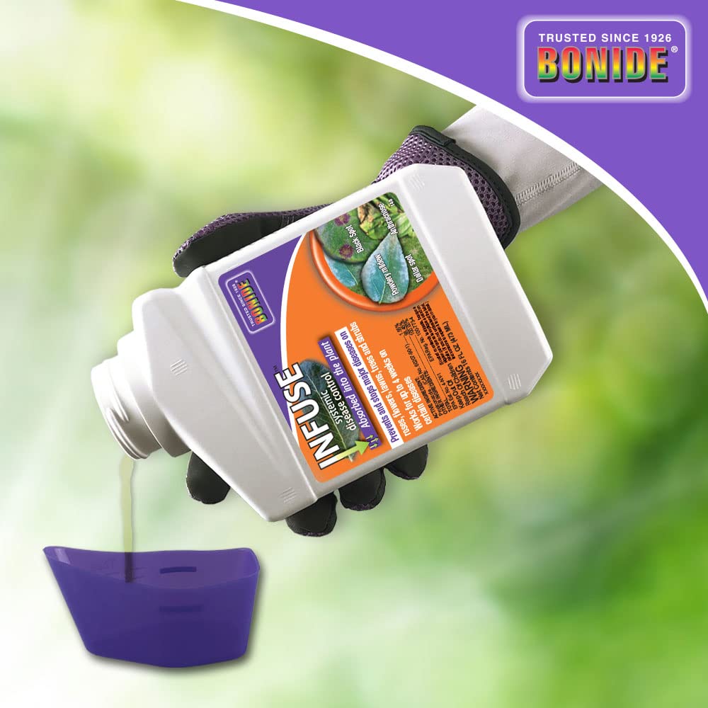 Spray application being applied to a landscape bed with Infuse.