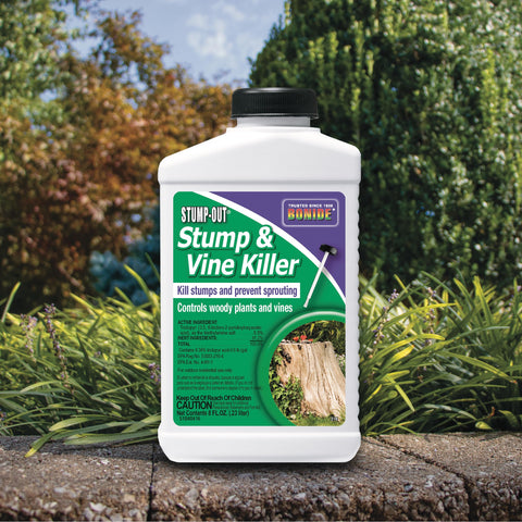 Bonide Stump-Out targeting woody vines and brush in a yard.