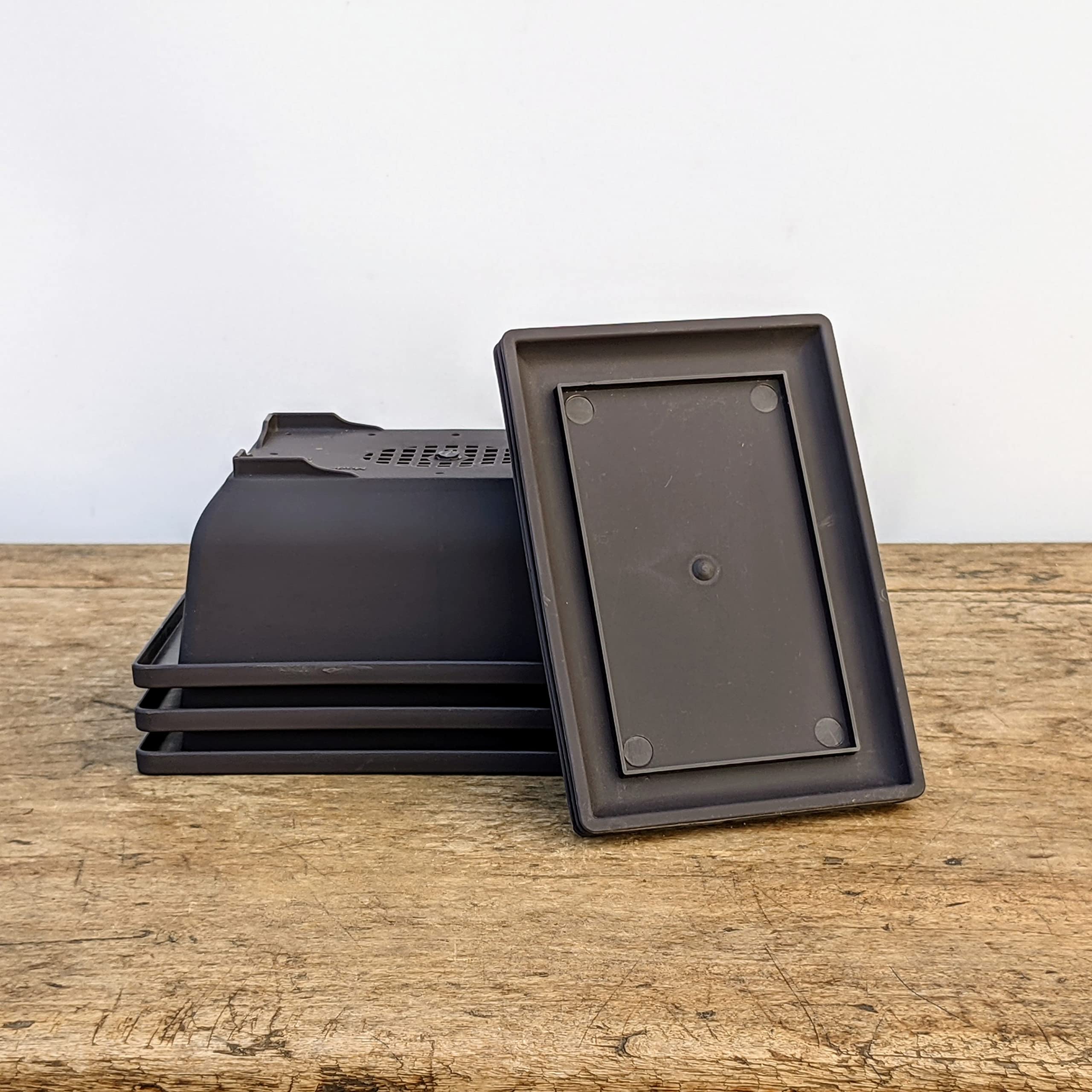 Bonsai Outlet stackable design for easy transport and storage.