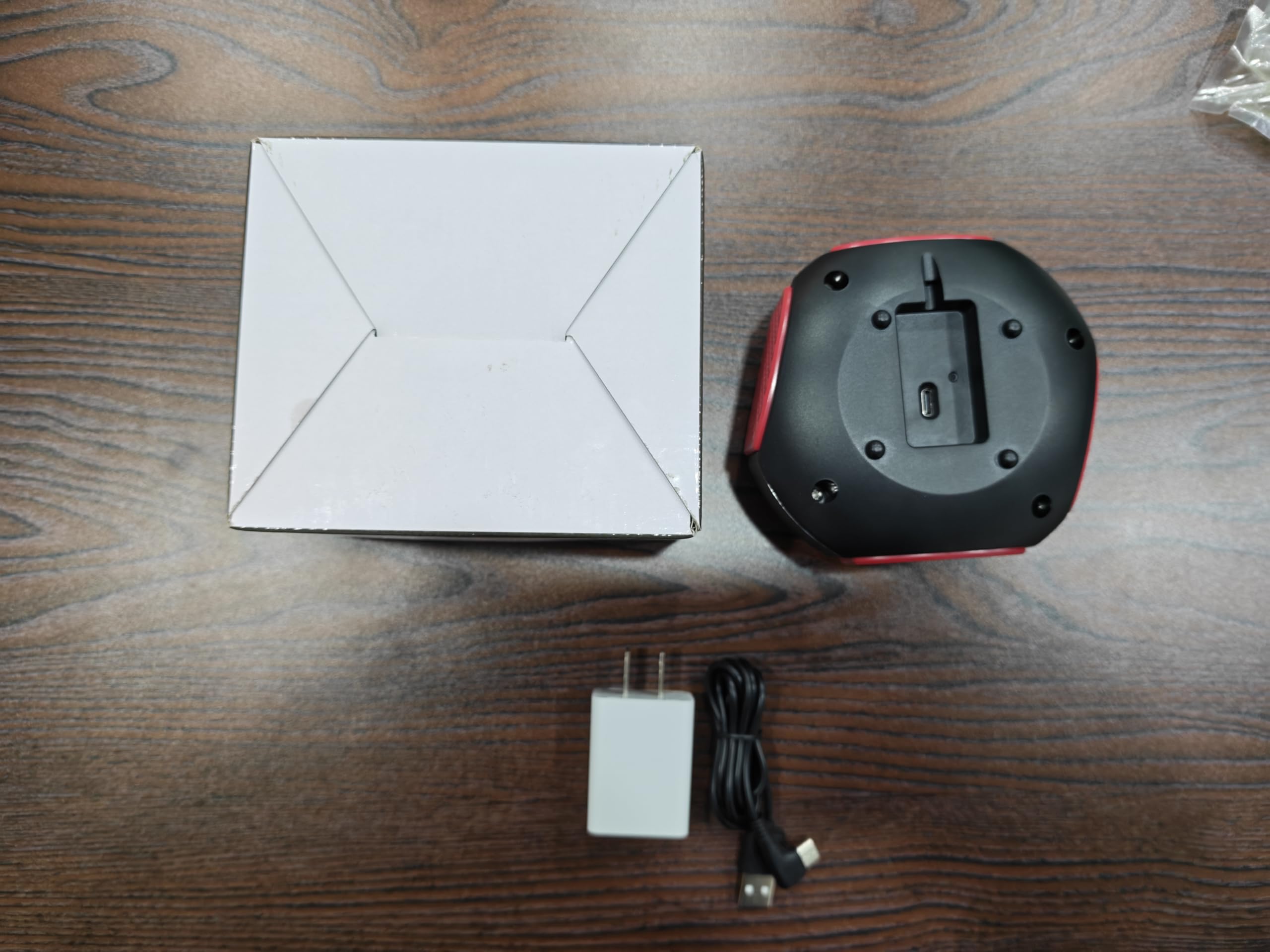 BORHOOD device installed in garage guarding stored items from rodents