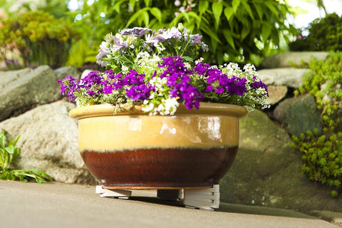 Bosmere Pot Toes on uneven surface keep planters level and stable.