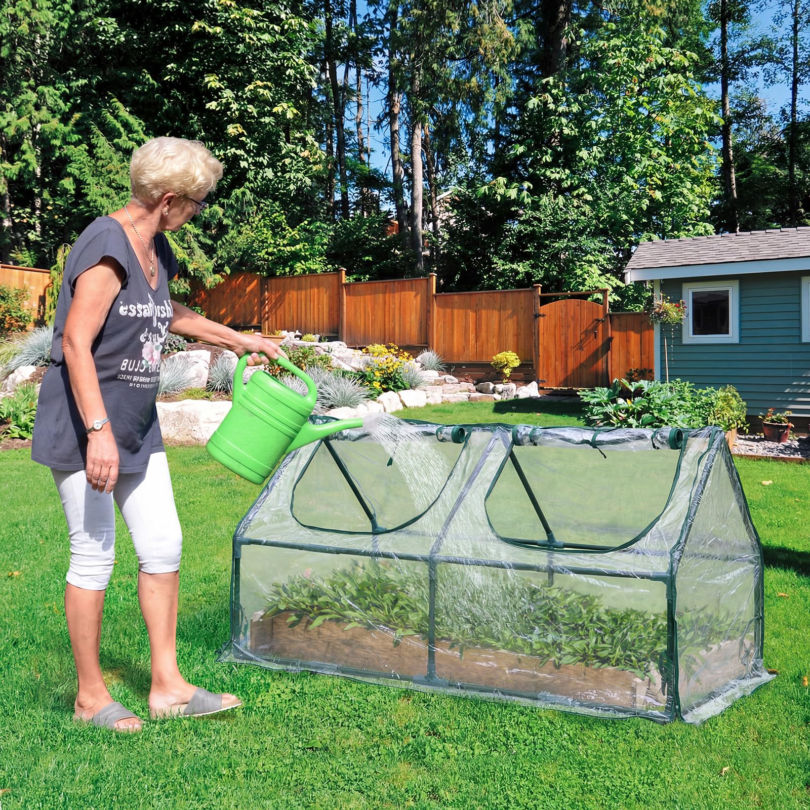 BPS mini greenhouse shows roll-up zipper windows for easy access and airflow.
