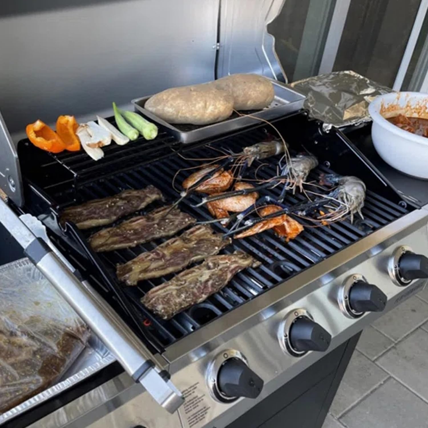 BQMAX outdoor grilling session with cast iron grate for flavorful searing