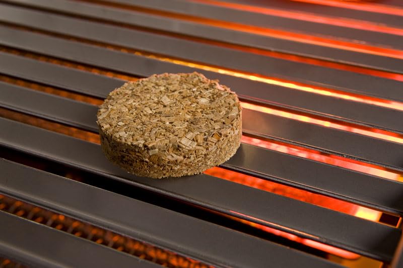 Close-up of wood bisquettes with apple aroma for enhanced barbecue flavor.