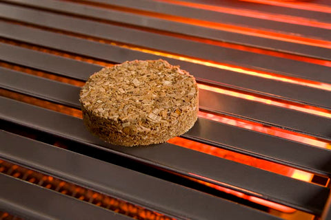 Bradley Smoker Hickory smoke rising from bisquettes in action.