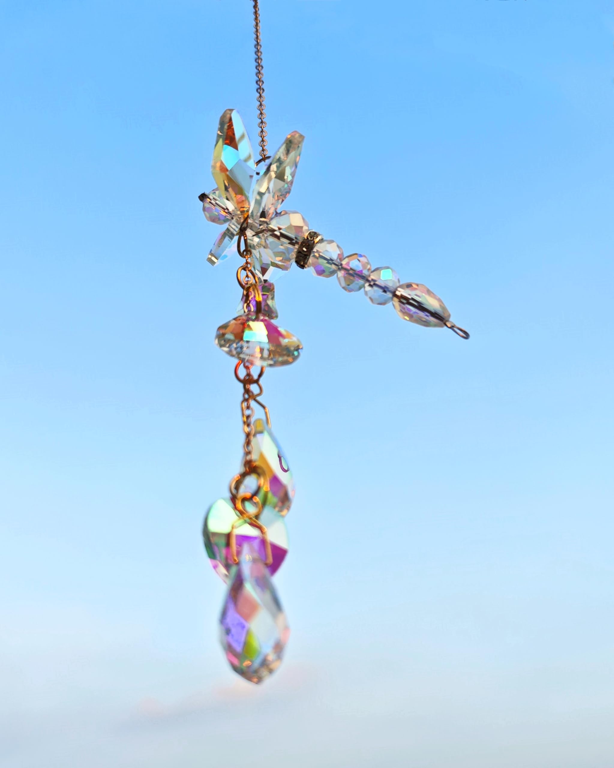 Brezalysia sun catcher hangs where sunlight dances, casting shimmering reflections