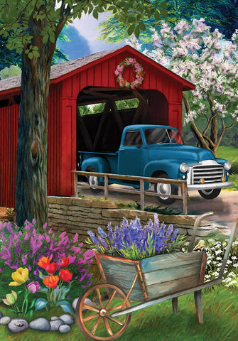 Briarwood Lane Bridge in Blooms Spring flag enhances porch curb appeal with weather-ready color