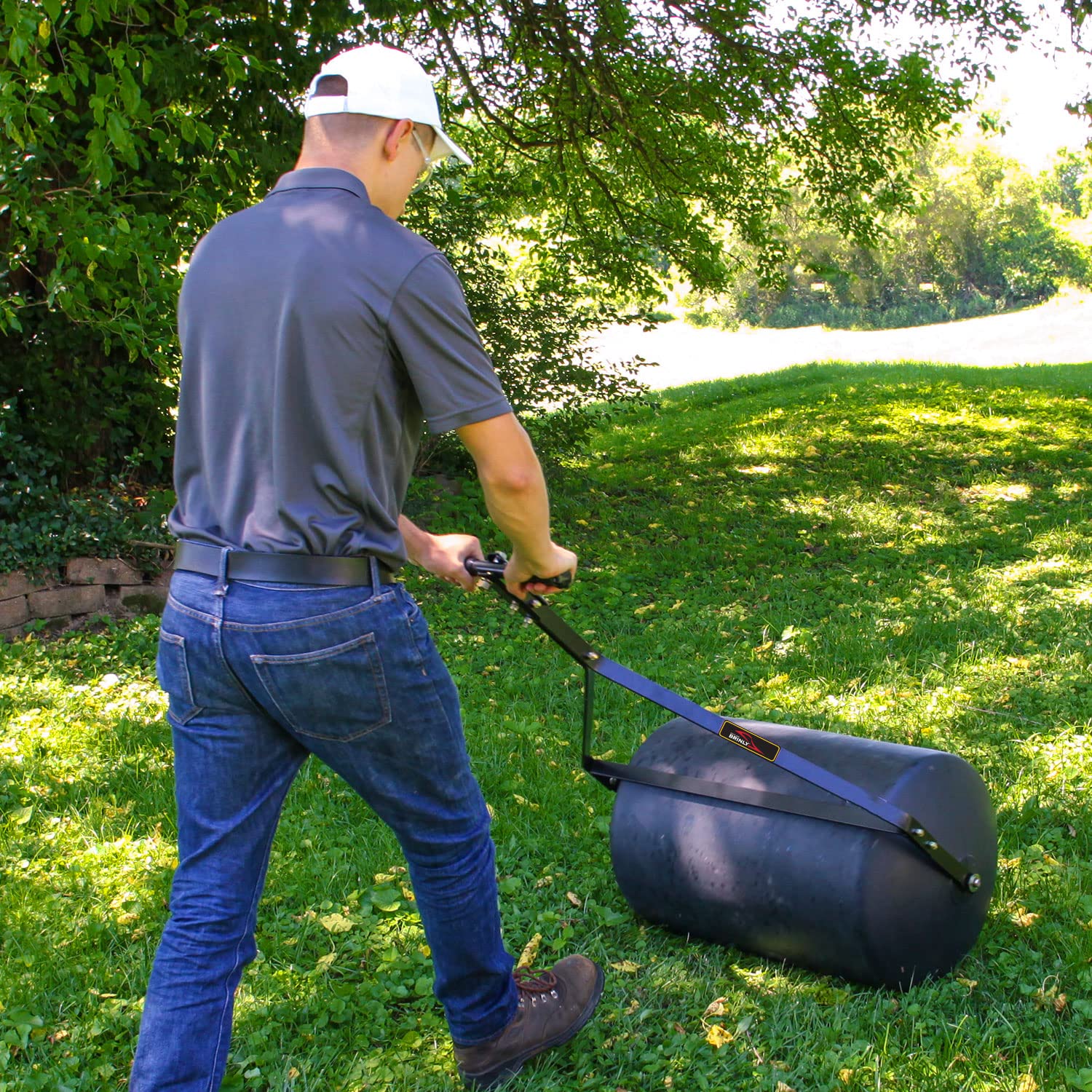 Brinly PRC-24BH towed behind a tractor provides efficient coverage over large lawns.