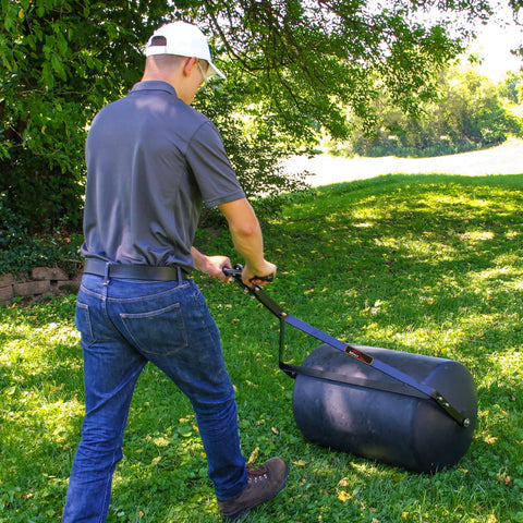 Brinly PRC-24BH towed behind a tractor provides efficient coverage over large lawns.