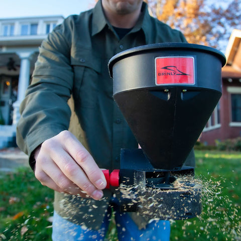 Brinly ergonomic trigger handle reduces effort during spreading.