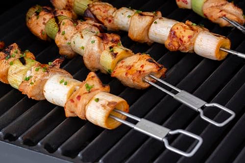 Set of four Broil King skewers ideal for family grilling and gatherings.